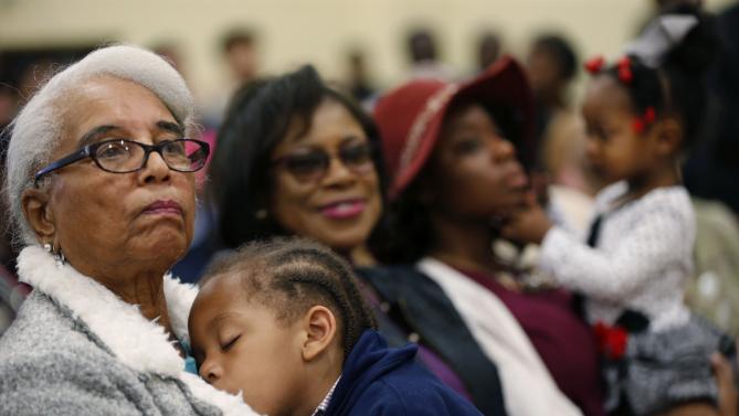 Audience members listen as Democratic presidential candidate Hillary Clinton speaks at a campaign event at the Williamsburg County Recreation Center in Kingstree, S.C., Thursday, Feb. 25, 2016. (AP Photo/Gerald Herbert)