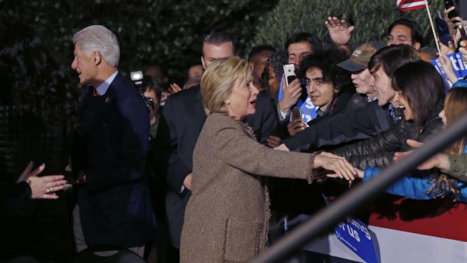 Democratic presidential candidate Hillary Clinton and her husband, former President Bill Clinton, greet supporters as they arrive to speak at a "Get Out The Vote Rally" in Columbia, S.C., Friday, Feb. 26, 2016. (AP Photo/Gerald Herbert)