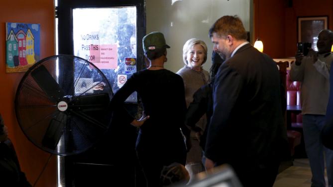 U.S. Democratic Presidential candidate Hillary Clinton arrives to greet voters at Hannibal's Kitchen in Charleston, South Carolina, February 26, 2016. REUTERS/Jonathan Ernst