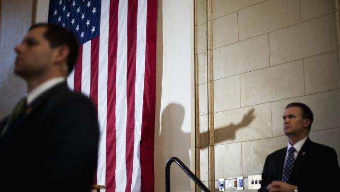 Democratic presidential candidate Hillary Clinton casts a shadow while speaking at a campaign event under the security of the secret service at the Old City Council Chambers in City Hall, Friday, Feb. 26, 2016, in Atlanta. (AP Photo/David Goldman)