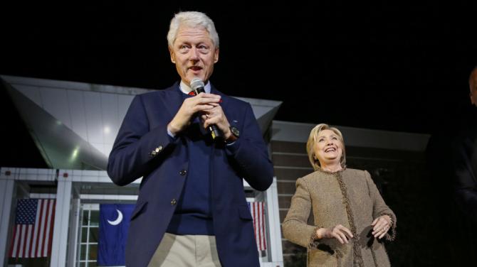 Democratic presidential candidate Hillary Clinton and her husband, former President Bill Clinton, speak at a "Get Out The Vote Rally" in Columbia, S.C., Friday, Feb. 26, 2016. (AP Photo/Gerald Herbert)