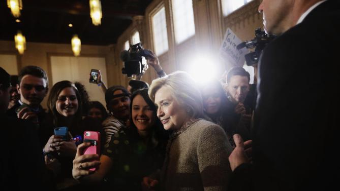 Democratic presidential candidate, Hillary Clinton poses for a selfie with an audience member as she greets the crowd at a campaign event at the Old City Council Chambers in City Hall, Friday, Feb. 26, 2016, in Atlanta. (AP Photo/David Goldman)