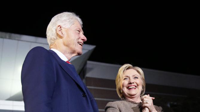 Democratic presidential candidate Hillary Clinton and her husband, former President Bill Clinton, arrive to speak at a "Get Out The Vote Rally" in Columbia, S.C., Friday, Feb. 26, 2016. (AP Photo/Gerald Herbert)