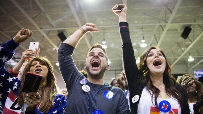 Audience members cheer as Democratic presidential candidate, Hillary Clinton is introduced at a campaign event at Miles College Saturday, Feb. 27, 2016, in Fairfield, Ala. (AP Photo/David Goldman)