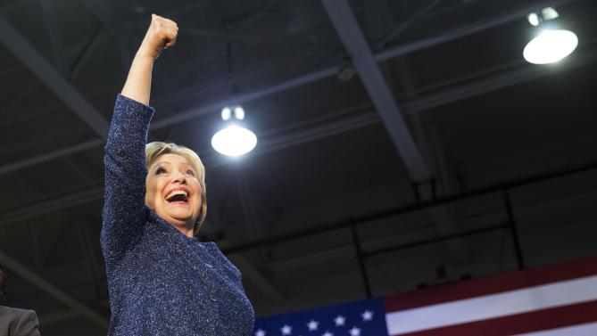 Democratic presidential candidate, Hillary Clinton gestures to the crowd as she takes the stage for a campaign event at Miles College Saturday, Feb. 27, 2016, in Fairfield, Ala. (AP Photo/David Goldman)