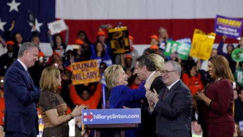 Democratic U.S. presidential candidate and former Secretary of State Hillary Clinton greets New York Governor Andrew Cuomo after a Hillary for America rally in New York March 2, 2016. REUTERS/Lucas Jackson