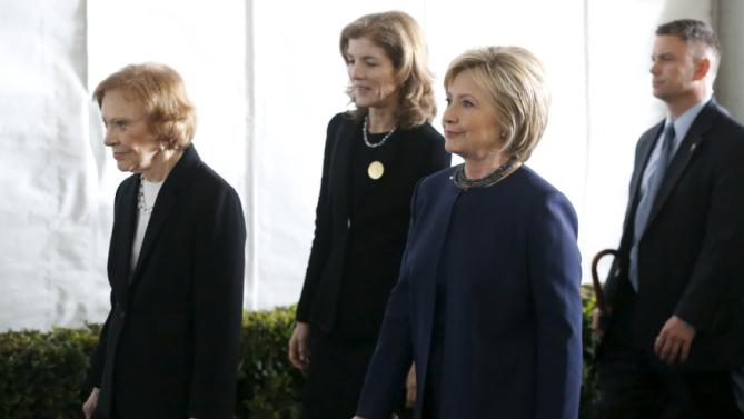 Former first lady Rosalynn Carter (L-R), Caroline Kennedy, and Hillary Clinton walk to the grave site after the funeral of Nancy Reagan at the Ronald Reagan Presidential Library in Simi Valley, California, United States, March 11, 2016. REUTERS/Lucy Nicholson