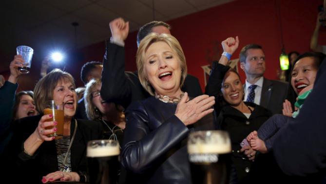Democratic U.S. Presidential candidate Hillary Clinton reacts as she visit a local bar during a campaign stop in Youngstown, Ohio, March 12, 2016. REUTERS/Carlos Barria