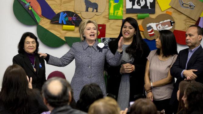 Democratic presidential candidate Hillary Clinton speaks during an immigration round table at The Resurrection Project at La Casa in the Pilsen neighborhood of Chicago, Monday, March 14, 2016. With Clinton at left is labor leader Dolores Huerta and far right is Rep. Luis Gutierrez, D-Ill. (AP Photo/Carolyn Kaster)