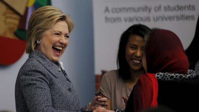 Democratic U.S. Presidential candidate Hillary Clinton shakes hands with a local resident as she attends a workshop meeting at La Casa The Resurrection Project, a immigrant community center, during a campaign stop in Chicago Illinois March 14, 2016. REUTERS/Carlos Barria