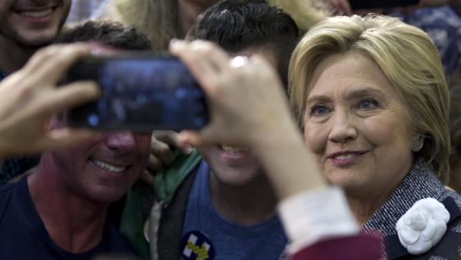 Democratic presidential candidate Hillary Clinton greets supporters and takes photos during a campaign event at the Grady Cole Center in Charlotte, N.C., Monday, March 14, 2016. (AP Photo/Carolyn Kaster)