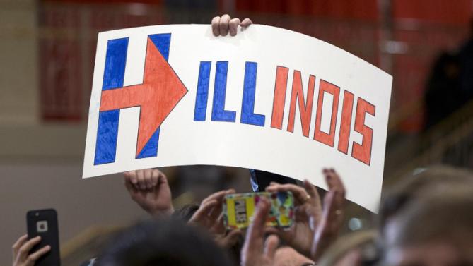 Supporters hold up a sign that reads "Hillinois" as Democratic presidential candidate Hillary Clinton speaks during a campaign event at Chicago Journeymen Local Plumbers Union in Chicago, Monday, March 14, 2016. (AP Photo/Carolyn Kaster)