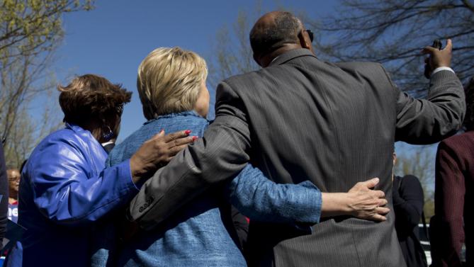 Democratic presidential candidate Hillary Clinton greets people as she visits a polling place a Southeast Raleigh Magnet High School in Raleigh, N.C., Tuesday, March 15, 2016. (AP Photo/Carolyn Kaster)