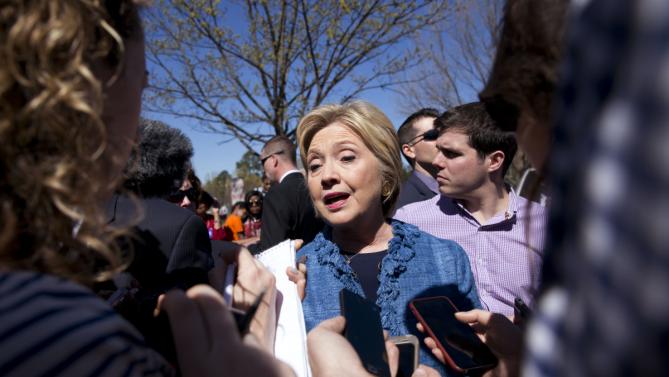 Democratic presidential candidate Hillary Clinton talks to media as during a visits to a polling place a Southeast Raleigh Magnet High School in Raleigh, N.C., Tuesday, March 15, 2016. (AP Photo/Carolyn Kaster)