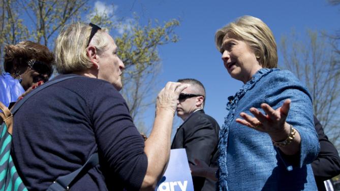 Democratic presidential candidate Hillary Clinton talks with a woman as she greets people at a polling place at Southeast Raleigh Magnet High School in Raleigh, N.C., Tuesday, March 15, 2016. Clinton faces Democratic rival Bernie Sanders in primary contests in five states on Tuesday: North Carolina, Florida, Ohio, Missouri and Illinois. (AP Photo/Carolyn Kaster)