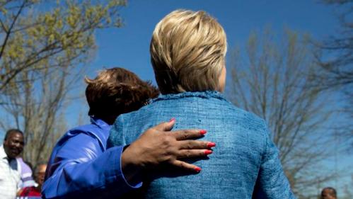 Democratic presidential candidate Hillary Clinton turns to pose for a photograph with a supporter as she greets people at a polling place at Southeast Raleigh Magnet High School in Raleigh, N.C., Tuesday, March 15, 2016. Clinton faces Democratic rival Bernie Sanders in primary contests in five states on Tuesday: North Carolina, Florida, Ohio, Missouri and Illinois. (AP Photo/Carolyn Kaster)