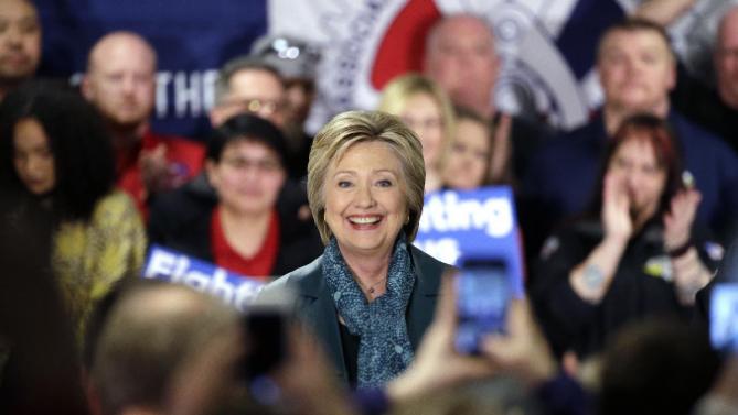 Democratic presidential candidate Hillary Clinton smiles as she takes to the stage during a campaign event at the Boeing Machinists' union hall Tuesday, March 22, 2016, in Everett, Wash. (AP Photo/Elaine Thompson)