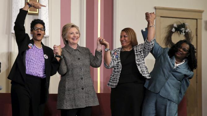 U.S. Democratic presidential candidate Hillary Clinton (2nd L) is joined by Geneva Reed-Veal (L), Annette Holt (2nd R) and U.S. Rep. Gwen Moore (D-WI) at a campaign event at Tabernacle Community Baptist Church in Milwaukee, Wisconsin, United States, March 29, 2016. REUTERS/Jim Young