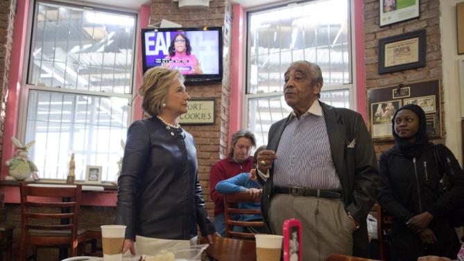 Democratic presidential candidate Hillary Clinton, left, meets Rep, Charles Rangel, background, D-N.Y. during a campaign stop at the Make My Cake bakery, Wednesday, March 30, 2016, in the Harlem neighborhood of New York. (AP Photo/Mary Altaffer)