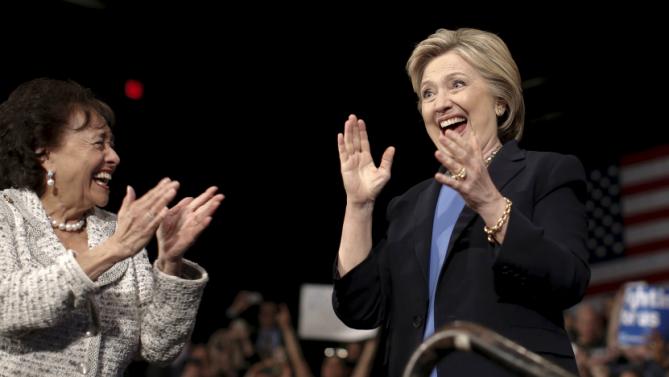 U.S. Representative Nita Lowey (L) applauds U.S. Democratic presidential candidate Hillary Clinton (R) as she takes the stage for a campaign rally at State University of New York (SUNY) at Purchase in Westchester County, New York, March 31, 2016. REUTERS/Mike Segar
