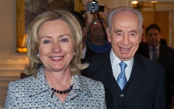US Secretary of State Hillary Clinton and Israeli President Shimon Peres (R) arrive for a meeting April 4, 2011 at Blair House, the presidential guest house, in Washington, DC. Peres will be meeting US leaders for talks aimed at furthering regional peace efforts. AFP PHOTO/Mandel NGAN (Photo credit should read MANDEL NGAN/AFP/Getty Images)