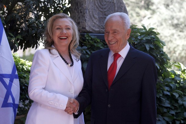 JERUSALEM, ISRAEL - JULY 16: (ISRAEL OUT) Israeli President Shimon Peres (R) shakes hands with US Secretary of State Hillary Clinton before their meeting on July 16, 2012 in Jerusalem, Israel. Clinton is in Israel to discuss diplomacy with Iran, Syria and Egypt in addition to peace talks regarding the Middle East. (Photo by Lior Mizrahi/Getty Images)