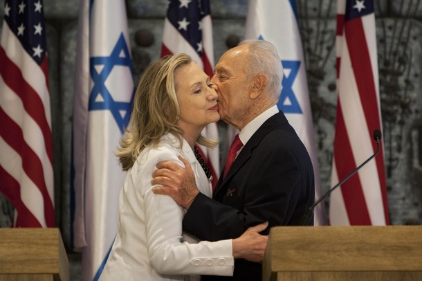 U.S. Secretary of State Hillary Rodham Clinton, left, and Israel's President Shimon Peres, hug after a joint statement at the President's residence in Jerusalem, Monday, July 16, 2012. Clinton met Peres for about an hour as part of what is perhaps her final visit to Israel as secretary of state, bringing a message of solidarity to the Jewish state after three-and-a-half years of only stunted progress toward a Palestinian peace deal. (AP Photo/Oded Balilty)