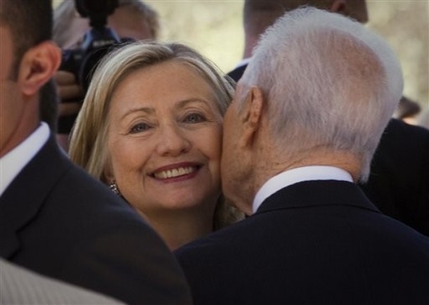 US Secretary of State Hillary Rodham Clinton, left, is greeted by Israeli President Shimon Peres, as she arrives at the Israeli presidential residence in Jerusalem, Wednesday, Sept. 15, 2010. Clinton is in the region for peace talks between Israeli and Palestinian leaders and will try to defuse a looming crisis over Israeli settlement construction. (AP Photo/Bernat Armangue)